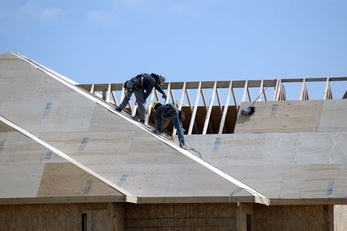 Roofing company workers