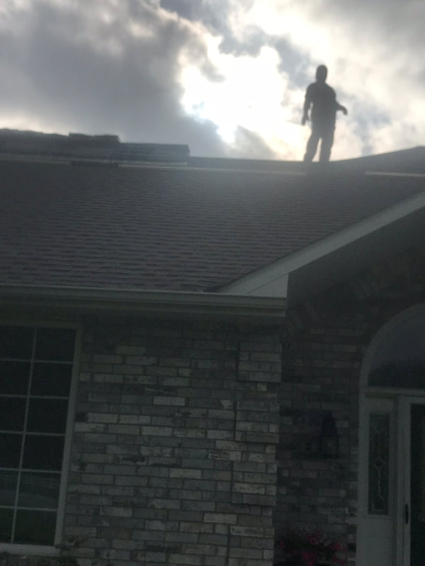 Roofer Laying Tiles